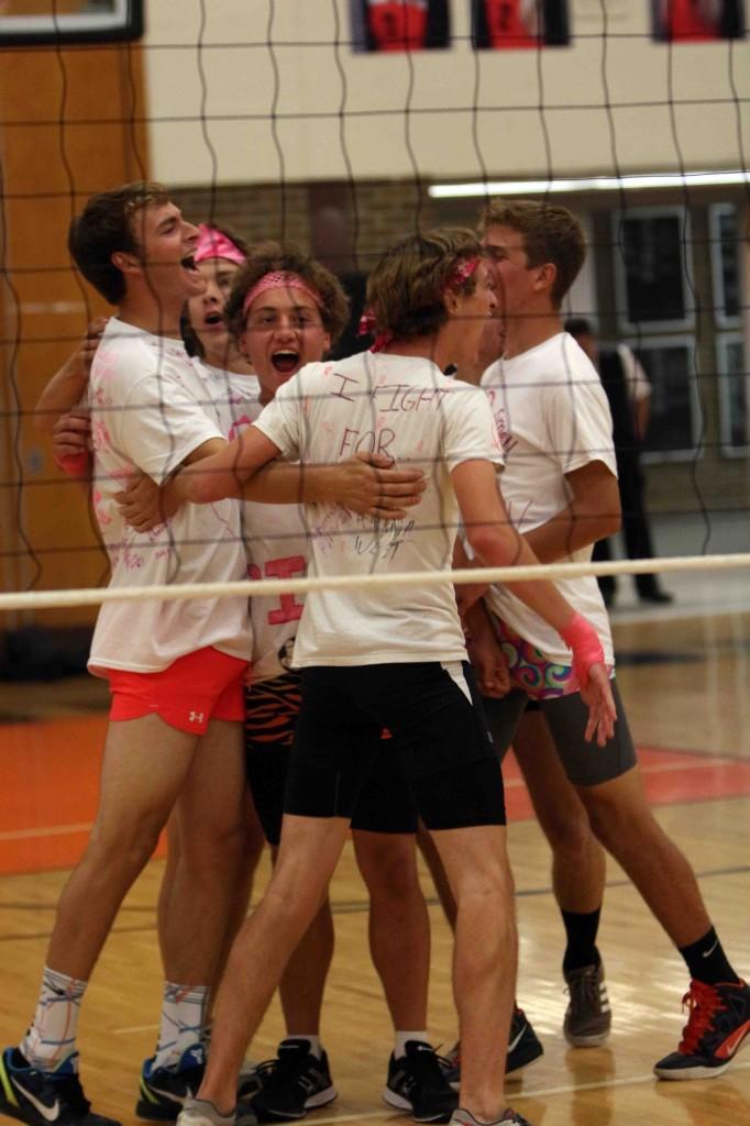 The soccer boys celebrate a point well earned during the Fighting For a Cure volleyball game