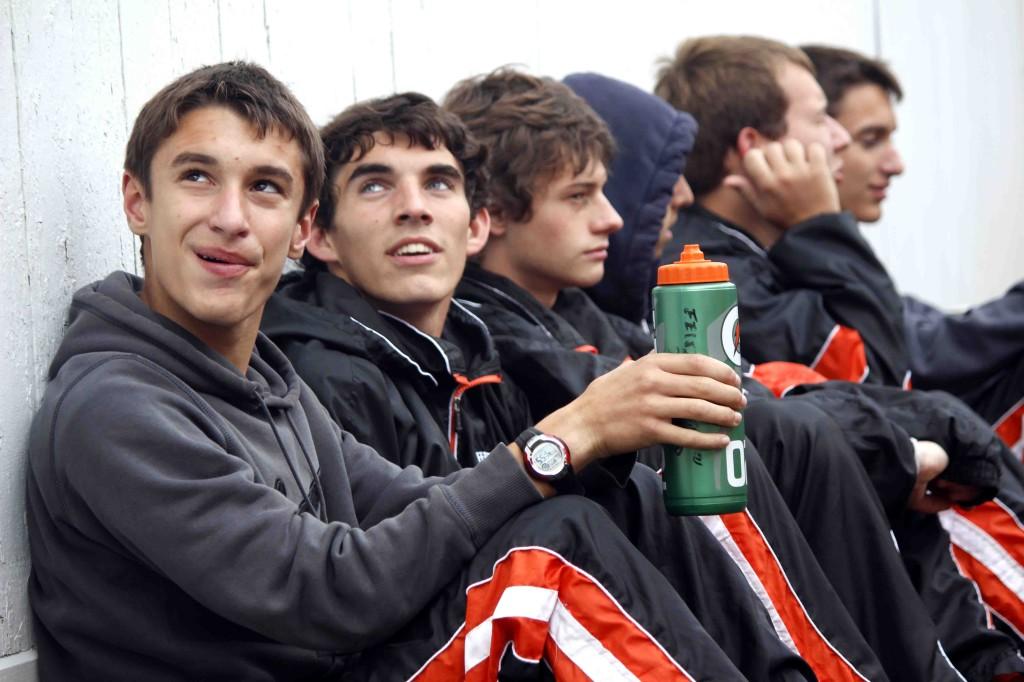 The Fenton Boys Cross Country team takes a break at the Holly Invitational 