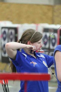 Pulling back on her bow, senior Hunter Hauk aims for the target. Hauk has been practicing archery since 2009 and is hoping to attend the 2016 Summer Olympics.  