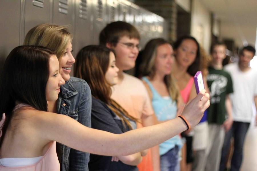 Students in Biology teacher Lisa Stewarts SRT line up for the selfie chain organized by the yearbook staff. The entire chain will be displayed in the 2013-14 edition of the yearbook.
