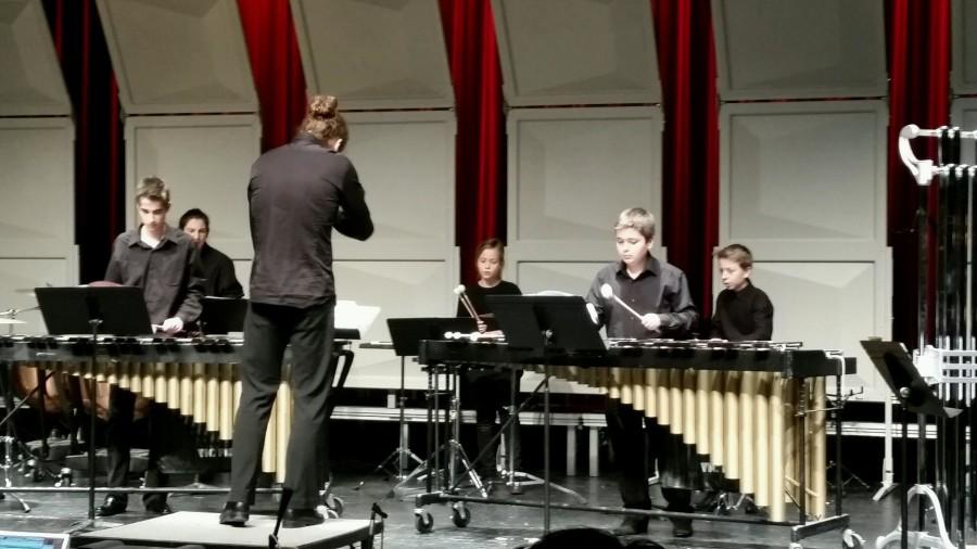 The junior percussion group performs the first piece of the night directed by Yohann Fievet.