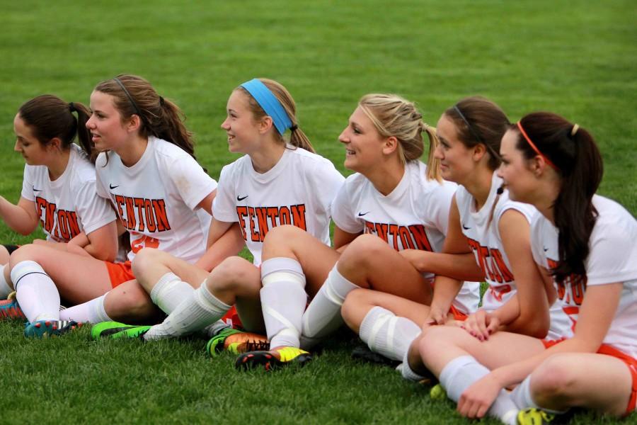 Huddled together on their annual Senior Night, seniors on the girls varsity soccer team listen to the stories shared by the underclassman. This time gives the entire team one last chance to remember the times they experienced together.