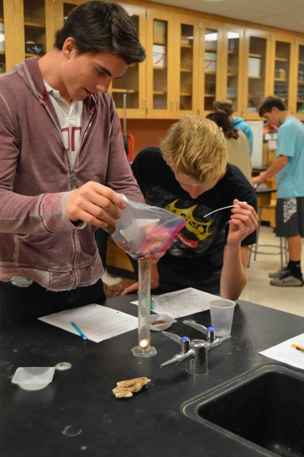 “We were measuring the density of pennies made from copper and pennies made from zinc,” senior Hudson Villeneuve. “We were dropping them into a graduated cylinder and measuring the distance that the water increased after it was dropped in to get the penny’s density.”
