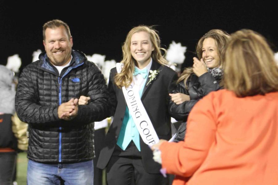Once senior Kate Lewandowskis name sounds through the stadium as the 2015 homecoming queen, alumnus Claire Wielichowski and her mother come forward to give Lewandowski the crown. Senior Zac Miceli was crowned 2015 homecoming king.