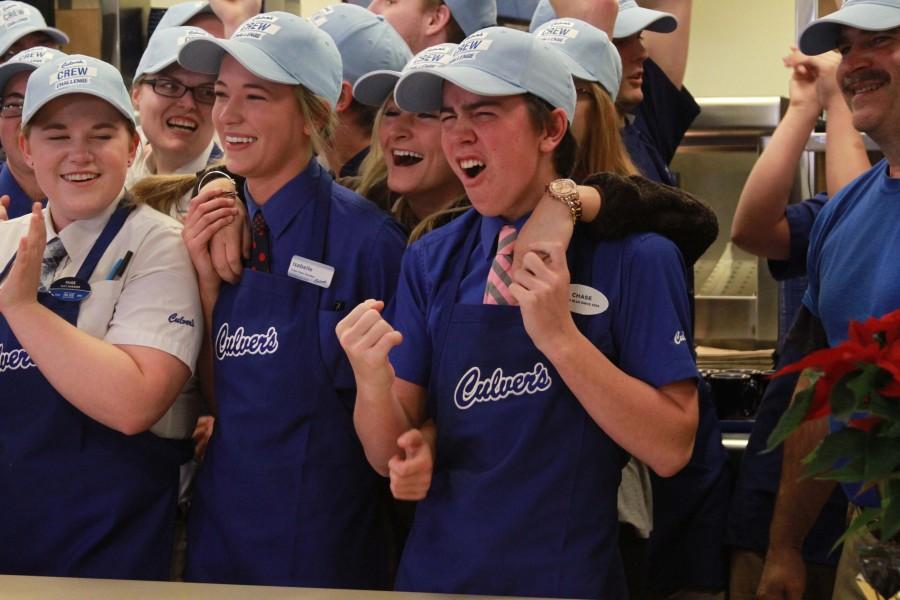 Culvers employees cheer on as they are congratulated by the company’s owner.