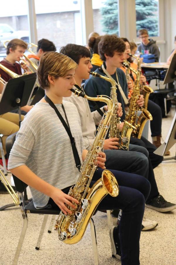 Playing+at+the+jazz+concert+during+lunch%2C+sophomore+Caitlin+Dailey+plays+Christmas+songs+with+the+jazz+band.+We+played+the+concert+just+to+have+fun%2C+it+went+really+well%2C+and+it+was+fun.+A+lot+of+the+songs+we+played+were+songs+that+we+already+knew+from+our+previous+concert+with+the+community+orchestra+so+we+only+had+to+learn+a+couple+more+Christmas+songs+for+this.