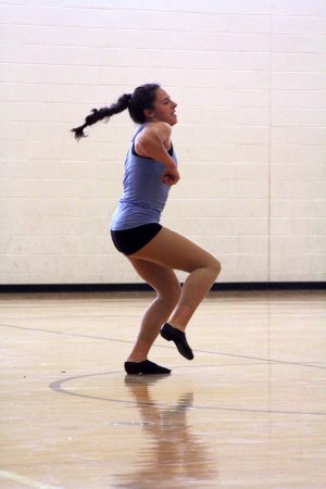 As the song Pep Rally by Missy Elliot plays in the background, sophomore Jamie Elrod free style dances. Each dancer took their turn dancing to this song, as they prepared for it to be the song they used for their first dance of the year. 