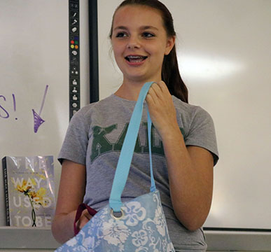 Freshman, Savanna Galley tells the class about how important her bag with her name on it means to her during her me bag presentation in Lindsay Gradys literature class. 