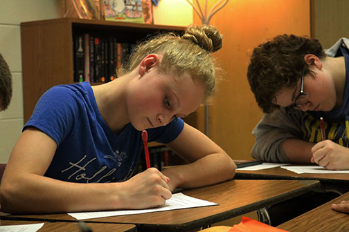 Freshman Stashia Campbell writes her expectations  for this school year in her 3A literature class with Lindsey Grady.