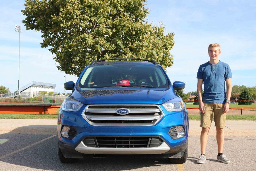 Receiving his 2017 Ford Escape did not come as a surprise but never the less he was happy when he could hold the keys himself. Junior Luke Lynch grins in appreciation next to the newest car in the parking lot. 