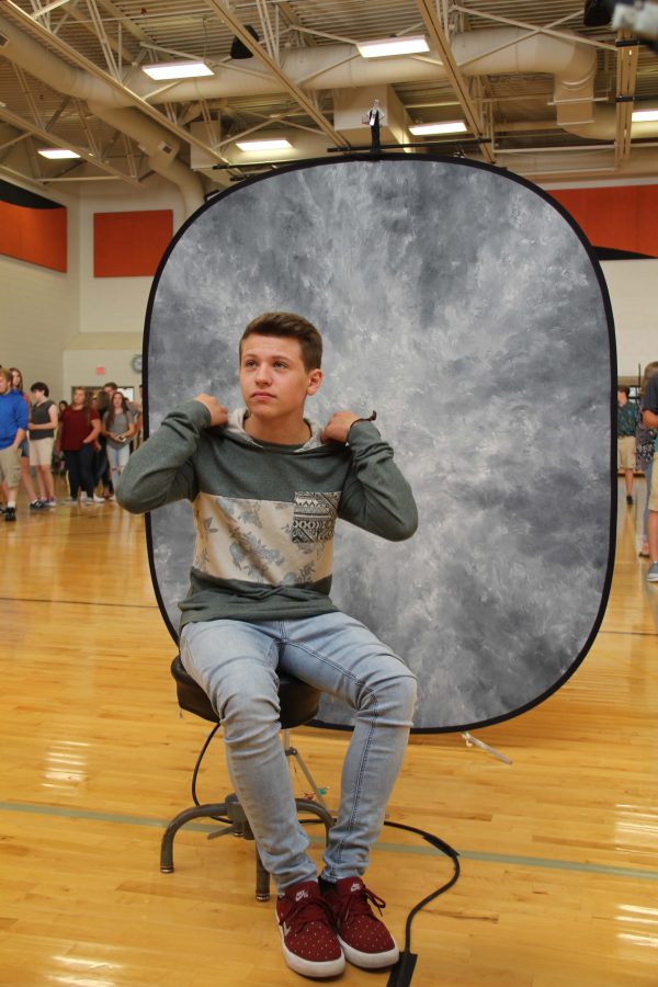 Junior Dylan Purtee sits down to prepare to get his pictures taken for this exciting school year. 