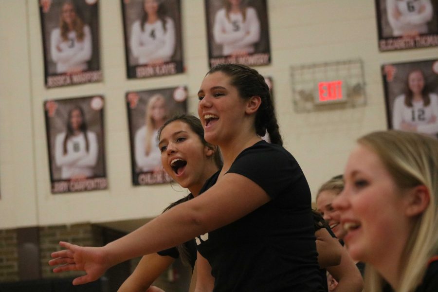While cheering on their teammate, juniors Libby Carpenter and Skylar Matthews express their excitement while playing Kearsley on September 20th, 2016.  The girls won the game with a final score of 3-0.