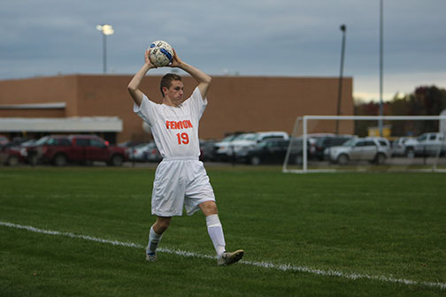 Competing against Fowlerville in the district final, senior Bobby Temple throws the ball back in during the game on Oct. 21.  The boys won against Fowlerville Gladiators 3-0 moving forward to regionals. 