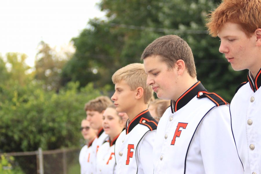 Sophomore Bradley Hanson marches with the other drummers in the Homecoming parade on October 7th, 2016.