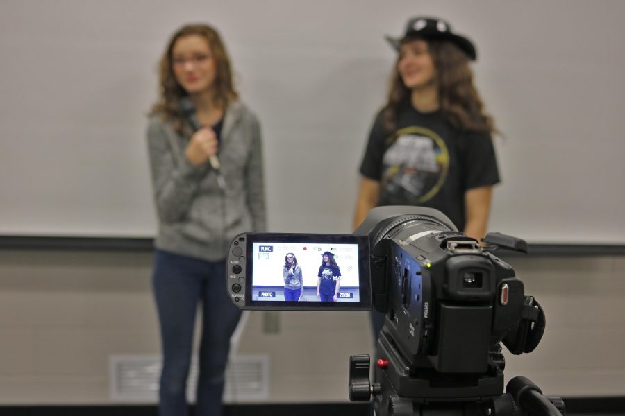 IB French students film their newscasts for an assignment. The information is being presented in French, so the students can display their skills.