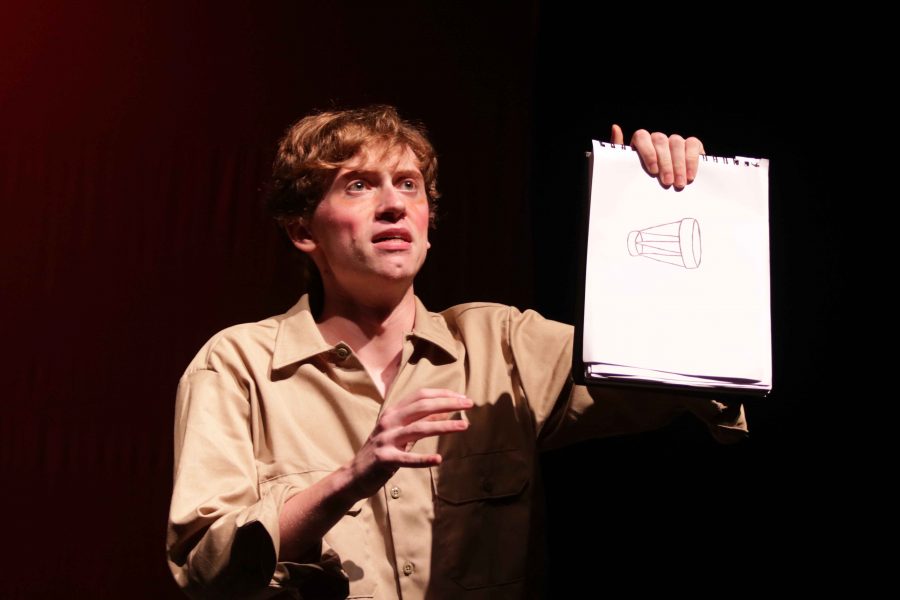 Junior Arlo Simmerman displays his drawing of a muzzle during The Little Prince performance on Saturday Nov. 12 at the 7:30 p.m. show.