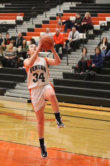 Lilly McKee making a lay-up for the freshman girls basketball team in a game against Davison.