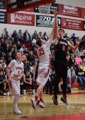 Senior Nick Wyrick goes up to make a shot during the last quarter, as a Linden player is ready to block him 