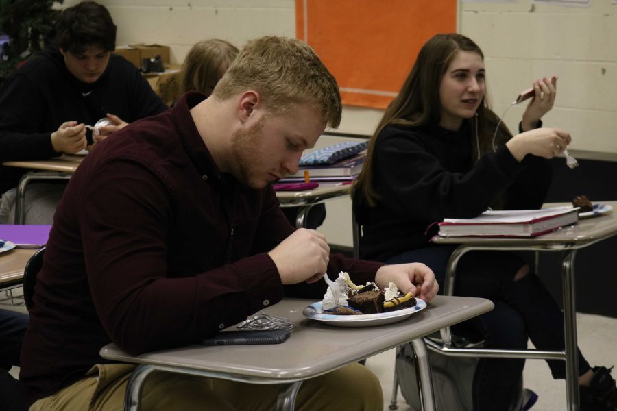 Sophomore Dane Dean celebrates Pi Day with his geometry class. The class brought in pie and other treats for the celebration. 