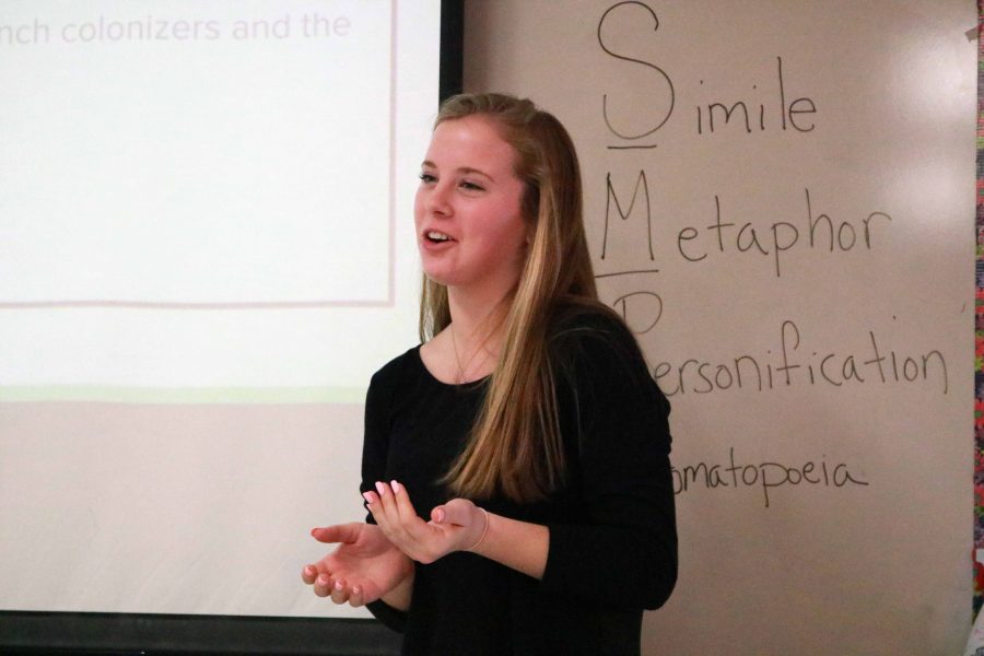 Leading a presentation in her IB Lit class, junior Riley Shegos explains a topic related to the novel The Stranger by Albert Camus. 