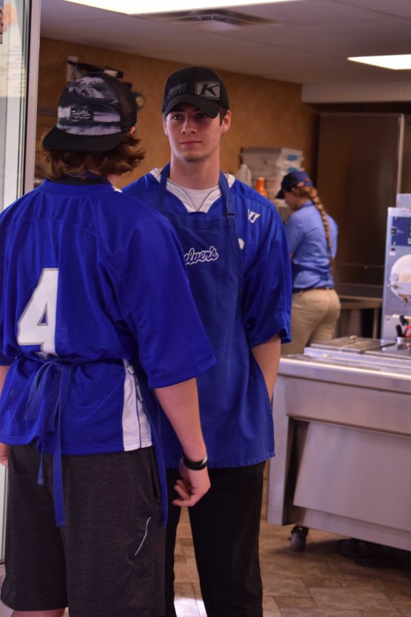 Taking a break after serving food, senior Philip Mckee, fund raises for the Fenton-Linden Lacrosse team’s spring season. As he served customers food for an hour, he hopes his work pays off for him and his team. 
