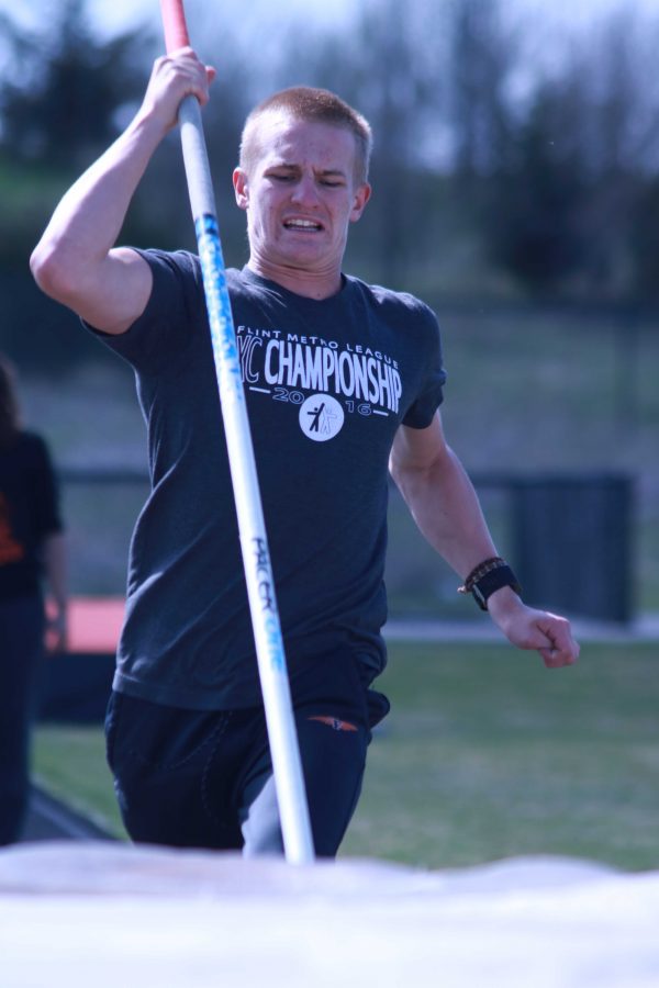 Running about to do the pole vault, sophomore Noah Maier shows determination in succeeding during practice. After achieving his pole vault in practice he hoped to do it in their meet which was April 20.
