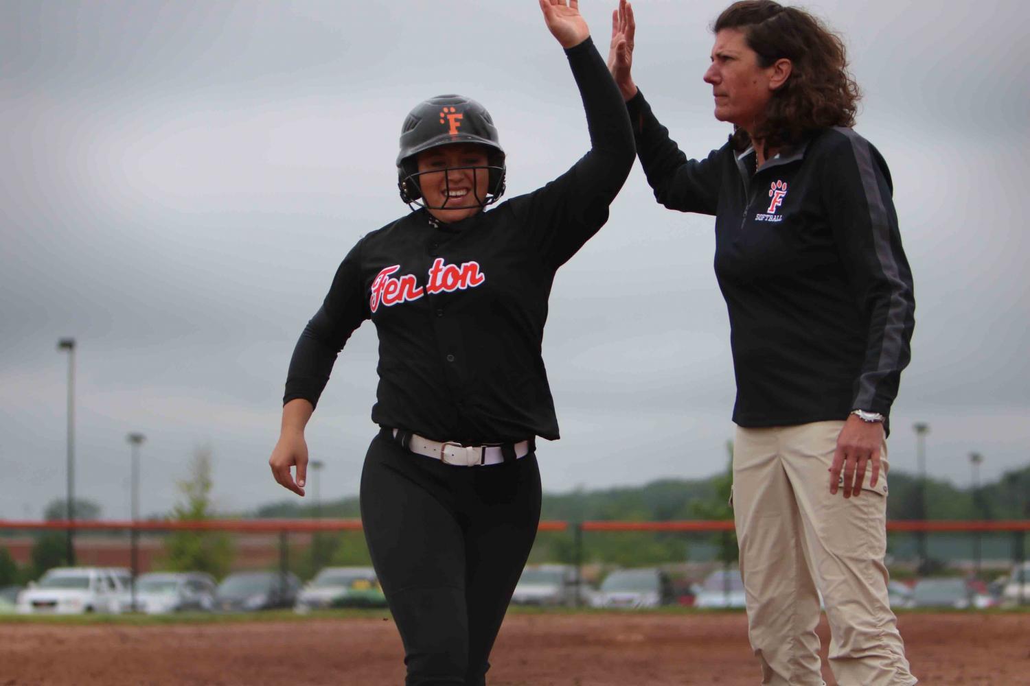 Highfiving Coach Roberts as she makes a run, senior Michaela Willett plays in her last home game as a high school athlete. At their game against Brandon the seniors were recognized for their season before graduating. 