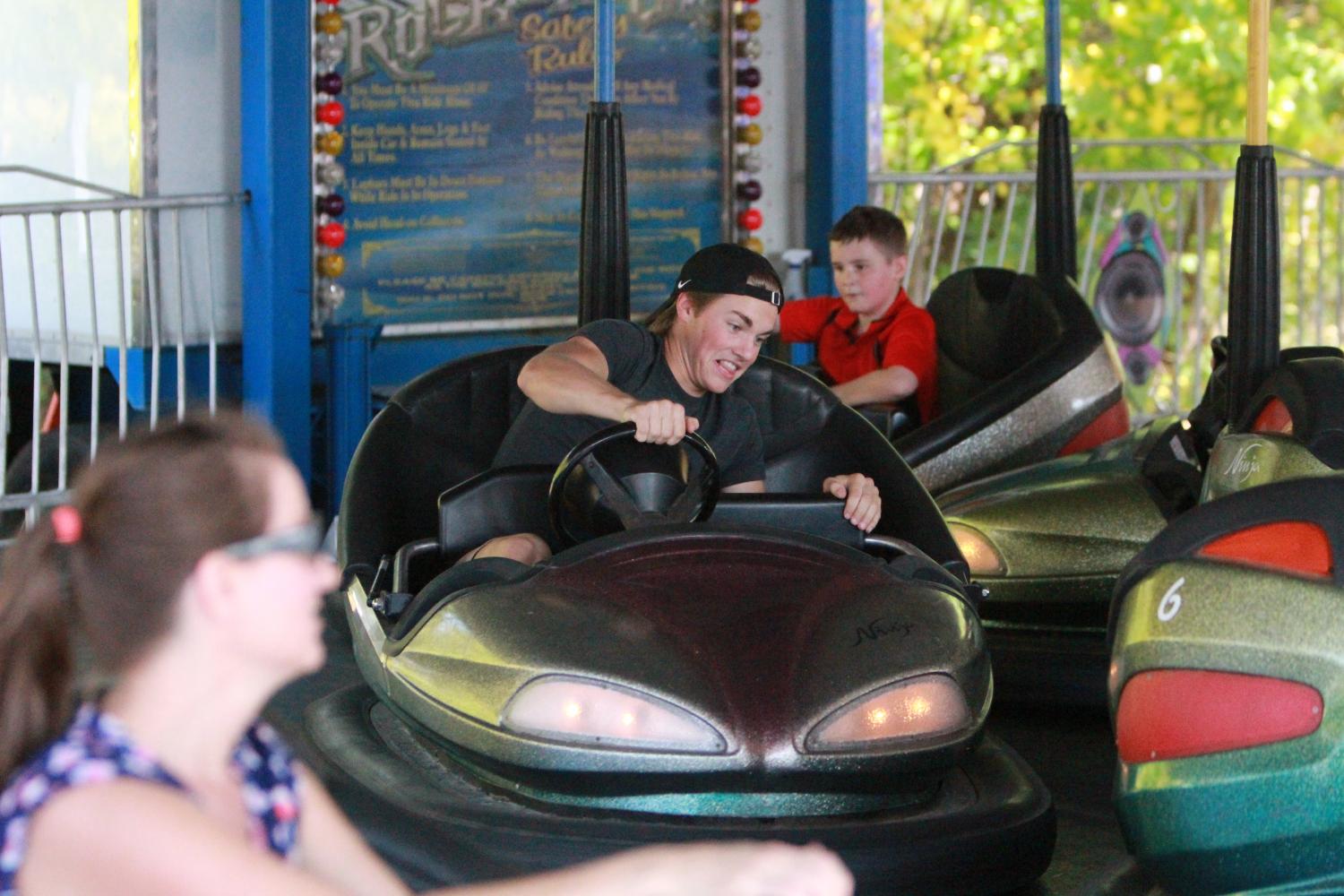Taking a ride on the go-karts, sophomore Andrew Donar attends Applefest on Sunday.