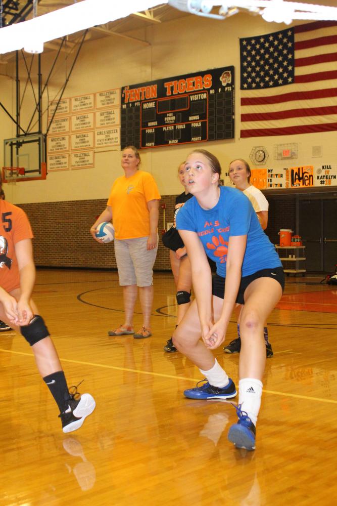 Freshman Sydney Sahr prepares to pass a volleyball over the net at a JV volleyball practice. On September 25th, the JV team practiced passing and hitting drills for an upcoming game. 