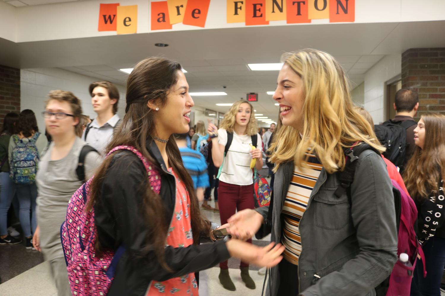 Just returning back to school, juniors Minna Ramirez and Halle Greenwald reunite in the hallway. 