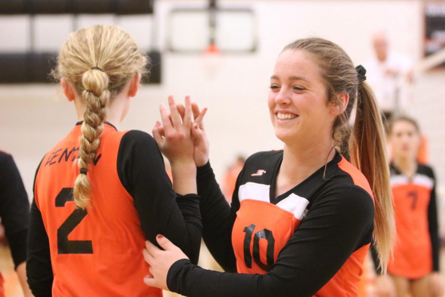 On October 25th, sophomore Hailee Prater wishes her teammate good luck during the JV volleyball game versus Grand Blanc. The girls went on to a victorious and exciting win, ending their season with pride. 