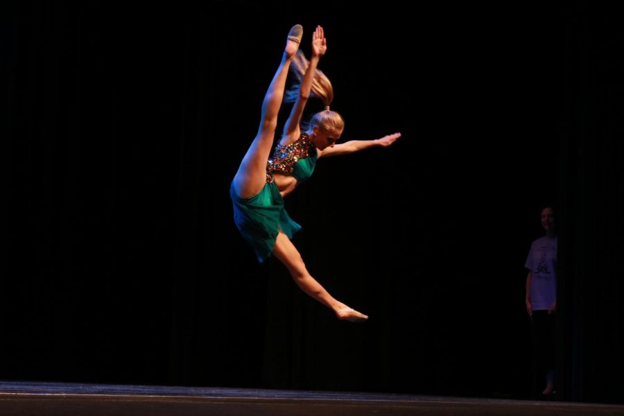 Sophomore Sydney Bommersbach does a tilt jump into the air for one of her many dances she performed at the 2017 Ms. Bridgets School of dance recital. Every dance was performed very successfully at all three recital nights.