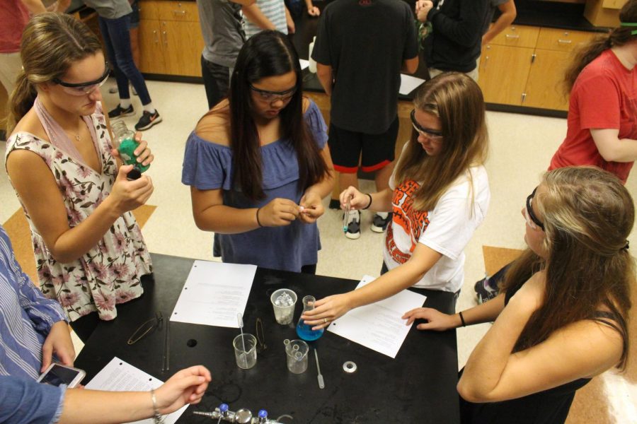 On September 27th, sophomore Lilian Huynh and juniors Maddie Hayden and Madi Wheeler work on a chemistry lab in Mr. Kasaks room. They worked together to complete their labs, using the scientific method to do the procedure. 