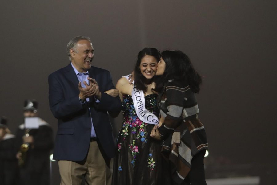 Hearing her name announced in front of the home stands, senior Ariana Mansour is crowned Homecoming Queen Oct. 6. 
