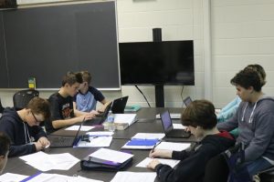 Working collectively in their pods, freshman Hunter Wheeler, Lucas  Shelton, Amir Bohdjelian, Jalen Plumbly along with other classmates use the new technology bought with the bond. 