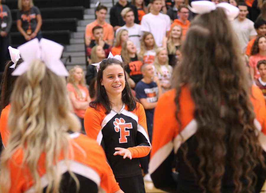 Senior Cheyenne Feltz cheers on the Fall sports teams as they were entering the auxiliary gym. Fenton High ended their homecoming week with a pep-assembly to get students hyped up for the dance on Saturday the 7. 

