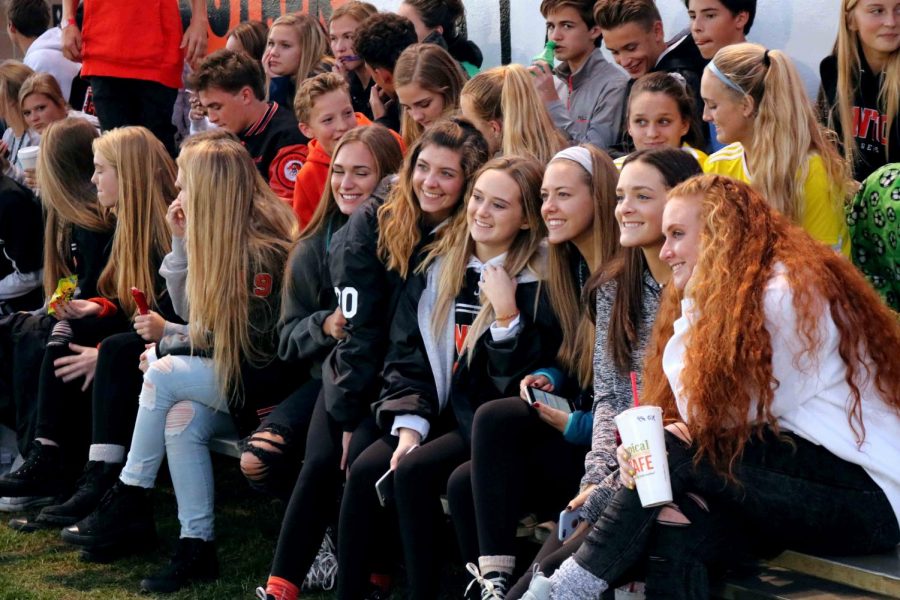 Since it was halftime juniors, natalie brown and many friends take a pictureb to pass time. Many students came out to support their fellow classmates while they play Linden for districts. 
