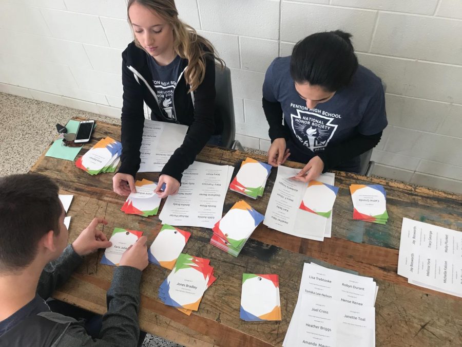 NHS members volunteer at the MI Google Conference hosted at FHS Nov. 8.  Volunteers helped make name tags for mini break out sessions Nov. 9.