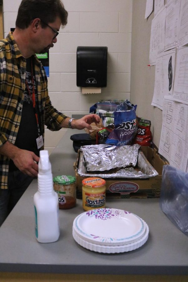 Andy Cocagne cleans up after his SRT party on November 21. Cocagnes class celebrated Thanksgiving by bringing in a variety of delicious foods. So much food was brought in that calls from the main office were requesting a plate to be brought to them.  
