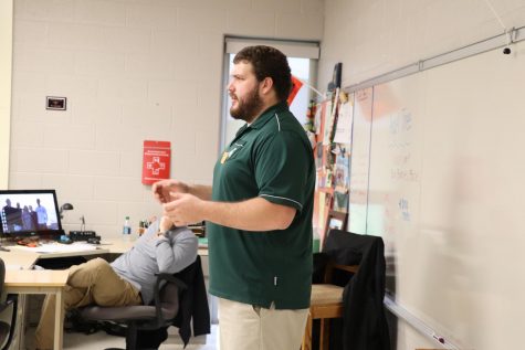 In Sports and Society, former MSU offensive lineman Benny McGowen, tells the class about his experiences playing Division 1 football. 