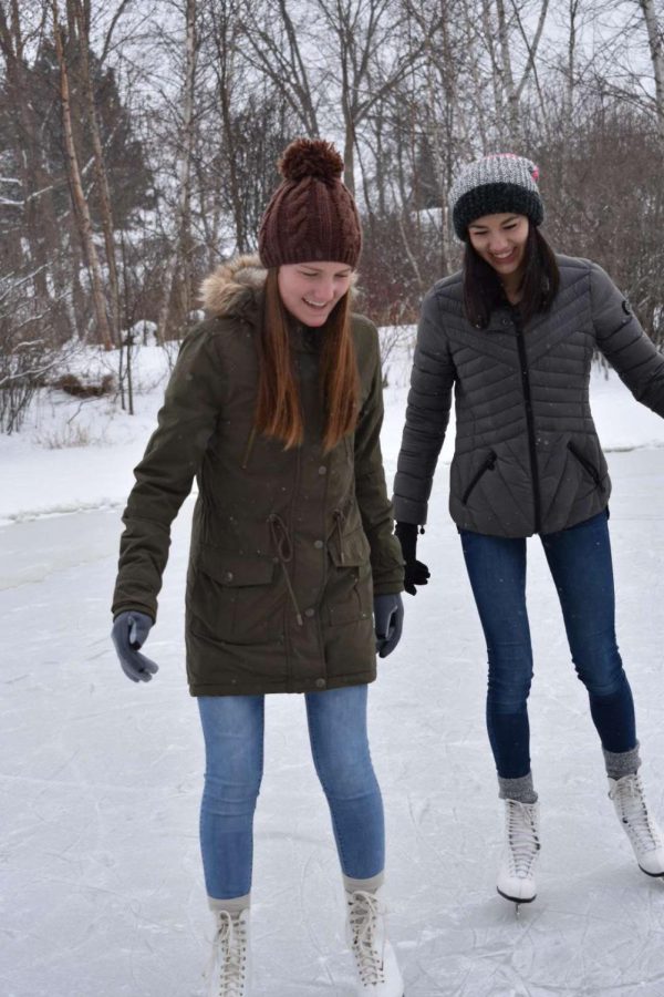 Despite the cold temperatures, sophomores Brooke Thomas and Cassie North venture out for an afternoon of ice skating.