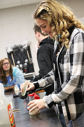 With water, sugar, and Yeast, sophomore Emma Harper finished up her Yeast lab and attempts to get the balloon to fill up with air. At the end of class, Harper, her partners, and the rest of the class examine the results and data to see whos balloon filled up the most.  