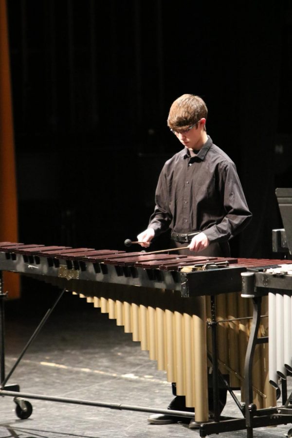 Playing the marimba junior Josh Katsef and the rest of the band program performed their holiday songs on Dec. 18. 