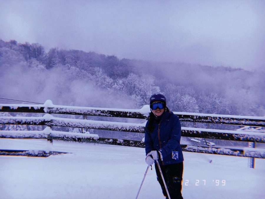 Freshman Kyla Lynch poses for a photo in between ski runs. Lynch along with her friends and family skied at Boyne Mountain during the winter break. 