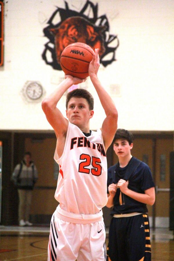 Sophomore Jacob Boulay shoots a free throw to score a point for his team. On Jan. 3 the JV boys basketball team won against Hartland.  