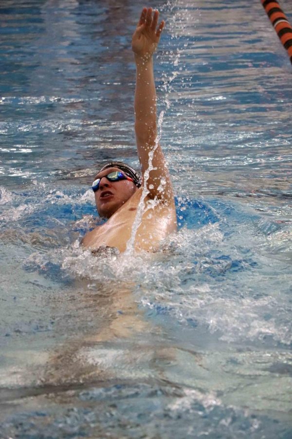 Competing in an event that he doesnt normally swim, junior Josh Kippe swims the 100 backstroke. The boys swim team took first place in their meet against Brandon’s swim team. 