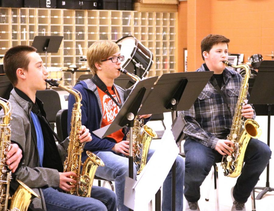 Freshman Thomas Scott plays his saxophone during a wind ensemble practice. On Jan. 10, students practiced music for their ensemble with a new conductor. 