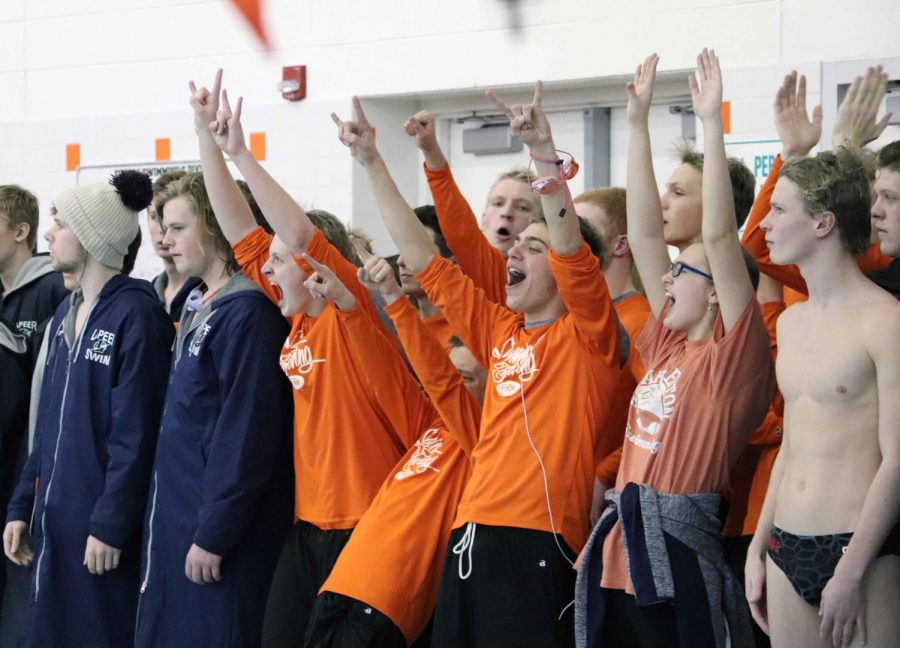 At this weekends meet, junior Joey Haiss shows his excitement as his teammate gets first place in his event. The boys swim team competed against approximately 12 schools and they earned second place at their county meet.