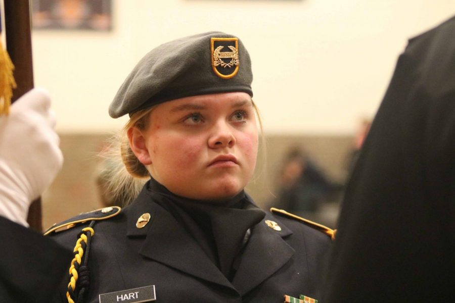 Junior Taylor Hart listens to her Commander for directions as the Flag Ceremony is about to start. On Dec. 22, during SRT the Jazz band and the Ambassadors were performing their holiday songs to Fenton High. 
