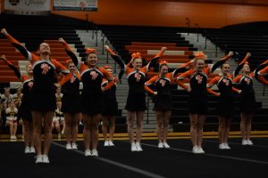Competing at home on Feb. 16, the girls varsity competitive cheer team participate in their districts meet.